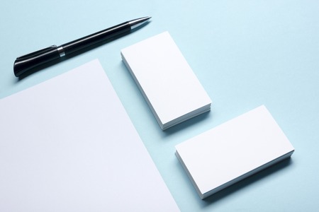 Business card blank over office table. Corporate stationery branding mock-up.の写真素材