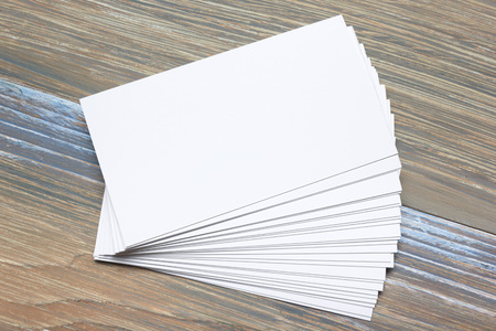Business card blank over office table. Corporate stationery branding mock-up.の写真素材