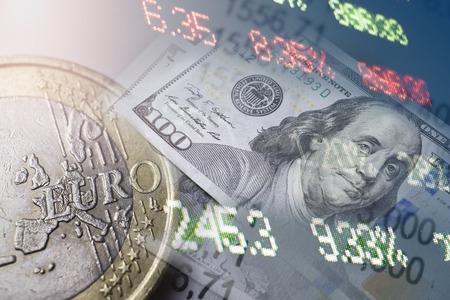 Finance and banking concept. Euro coins and us dollar banknote close-up. Abstract image of Financial system with selective focus, toned, double exposure.の写真素材
