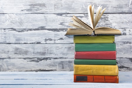 Open book, hardback books on wooden table. Back to school. Copy spaceの写真素材