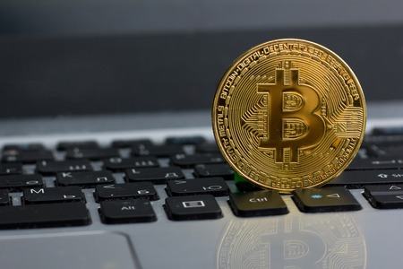 golden bitcoin coin on keyboard. New virtual money. Cryptocurrency. Business and Trading concept.の写真素材
