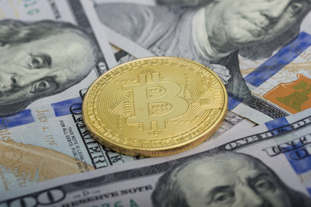 Bitcoin golden coin New virtual money and dollar background . Cryptocurrency. Business and Trading concept. Close-up shotの写真素材