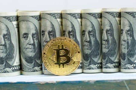 Bitcoin golden coin New virtual money and dollar background . Cryptocurrency. Business and Trading concept. Close-up shotの写真素材