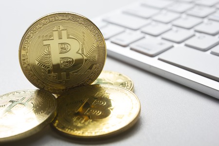 Bitcoin golden coin New virtual money and dollar background . Cryptocurrency. Business and Trading concept. Close-up shotの写真素材