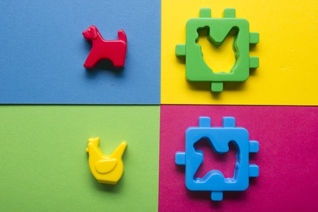 Kids educational developing toys frame on colorful background. Top view. Flat lay. Copy space for...