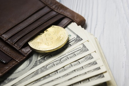 Bitcoin golden coin New virtual money and dollar background . Cryptocurrency. Business and Trading...