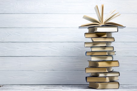 Open book, hardback books on wooden table. Back to school. Copy spaceの写真素材