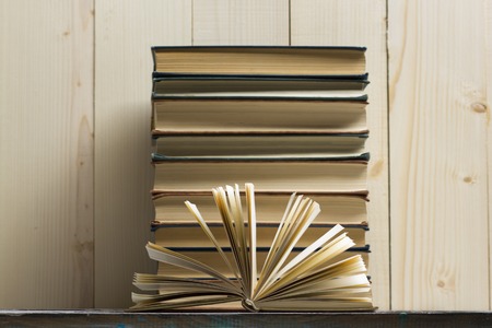 Open book, hardback books on wooden table. Back to school. Copy spaceの写真素材