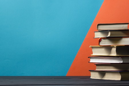 Open book, hardback books on wooden table. Back to school. Copy spaceの写真素材