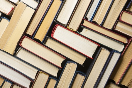 Stack of books background. many books piles.