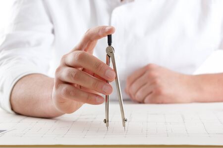 Architects working on blueprint. Architects workplace - architectural project, blueprints, ruler,...