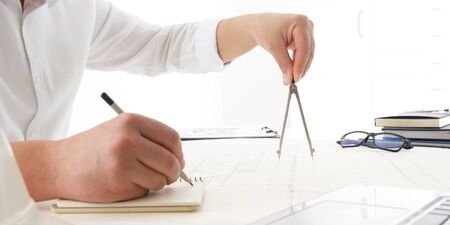 Architects working on blueprint. Architects workplace - architectural project, blueprints, ruler,...