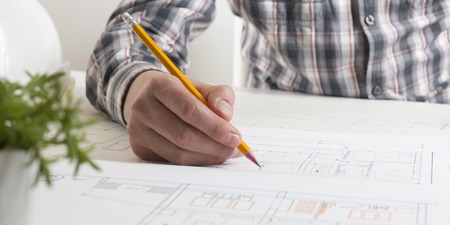 Architects working on blueprint, real estate project. Architect workplace - architectural project,...