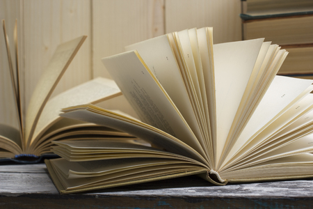 Open book, hardback books on wooden table. Back to school. Copy spaceの写真素材