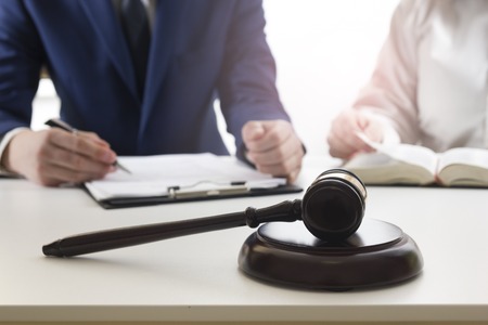 Law, advice and Legal services concept. Lawyer and attorney having team meeting at law firm.