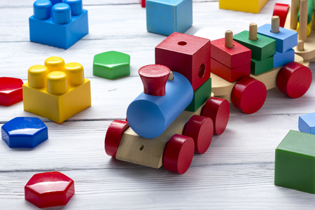 Kids educational developing toys frame on white background. Top view. Flat lay. Copy space for textの写真素材