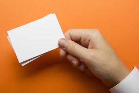 Hand holding business card blank on abstract backgroundの写真素材
