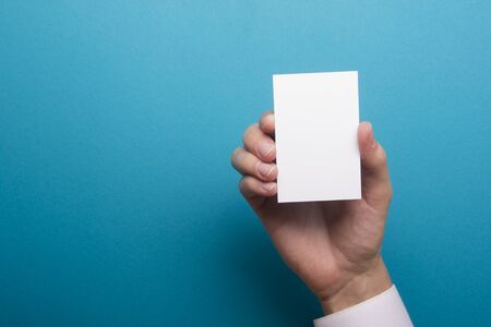 Hand holding business card blank on abstract backgroundの写真素材