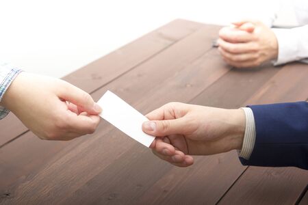 business executive exchanging business card blank. Copy spaceの写真素材