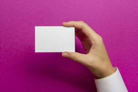 Hand holding business card blank on abstract backgroundの写真素材