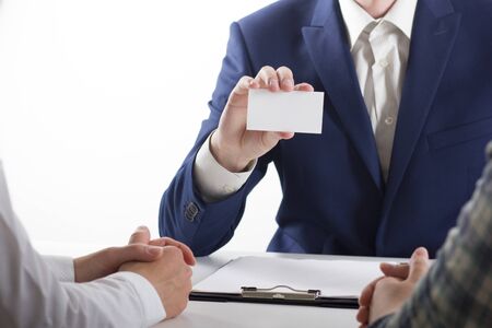 business executive exchanging business card blank. Copy spaceの写真素材