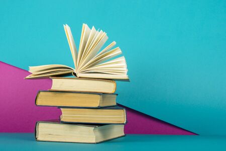 Open book, hardback books on wooden table. Back to school. Copy space