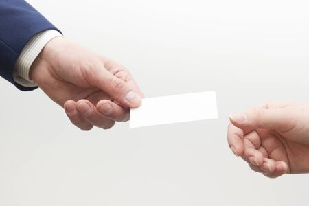 business executive exchanging business card blank. Copy spaceの写真素材