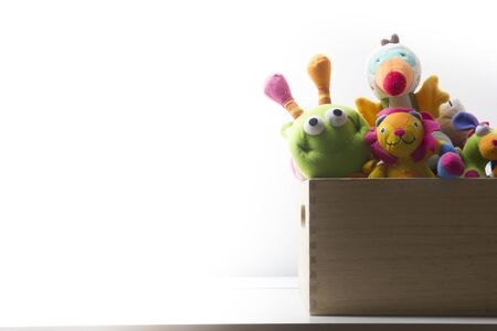 Toys collection in box isolated on white background. Donatation. Copy space for text