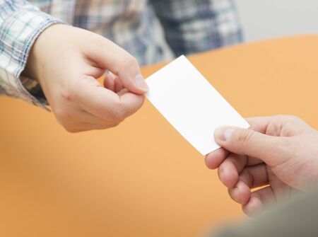 business executive exchanging business card blank. Copy spaceの写真素材