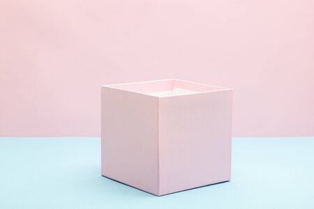 Empty, open white gift box on blue background with copy space.の写真素材