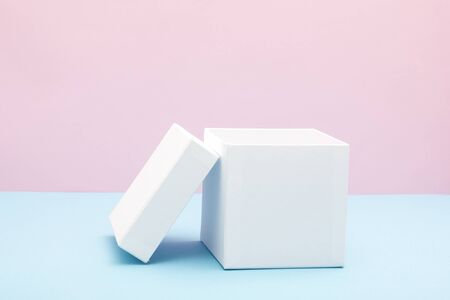 Empty, open white gift box on blue background with copy space.の写真素材