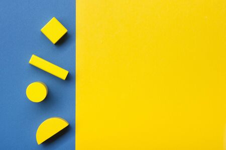 Colorful kids toys frame on wooden background. Top view. Flat lay. Copy space for text.の写真素材