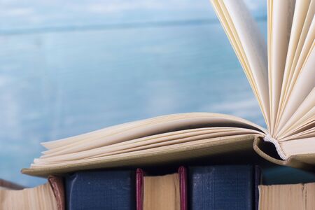 Open book, hardback books on wooden table. Back to school. Copy spaceの写真素材