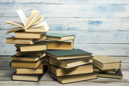 Open book, hardback books on wooden table. Back to school. Copy spaceの写真素材