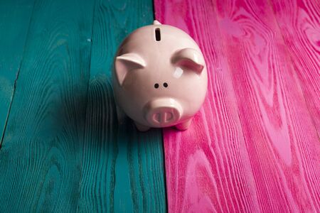 Piggy bank isolated on yellow background.の写真素材