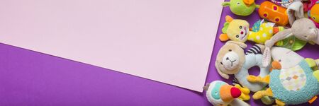 Colorful kids toys frame on wooden background. Top view. Flat lay. Copy space for text.の写真素材