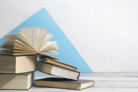 Open book, hardback books on wooden table. Back to school. Copy spaceの写真素材