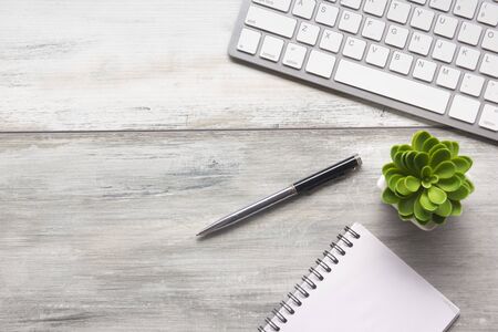 White desk office with laptop, smartphone and other work supplies with cup of coffee. Top view with copy space for input the text. Designer workspace on desk table essential elements on flat lay.の写真素材