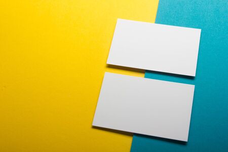 Business cards blank. Mockup on color background. Flat Lay. copy space for textの写真素材