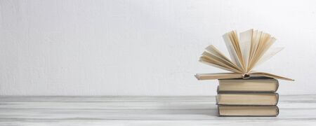 Open book, hardback books on wooden table. Back to school. Copy spaceの写真素材