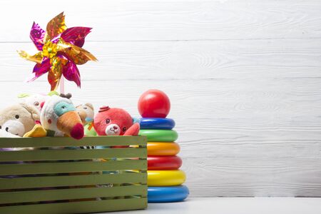 Kids educational developing toys frame on white background. Top view. Flat lay. Copy space for text.の写真素材