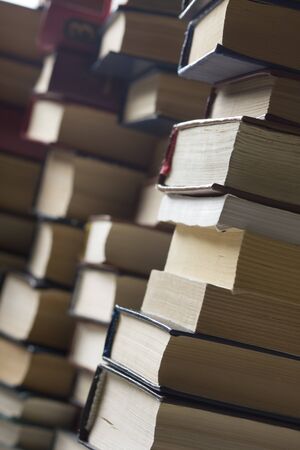 Stack of books background. many books piles.の写真素材