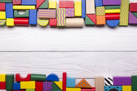 Kids educational developing toys frame on white background. Top view. Flat lay. Copy space for text.の写真素材