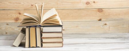 Open book, hardback books on wooden table. Back to school. Copy spaceの写真素材