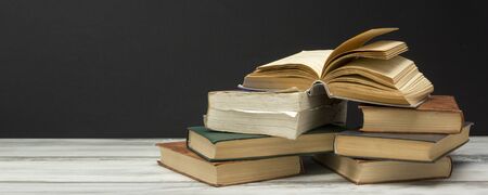 Open book, hardback books on wooden table. Back to school. Copy spaceの写真素材