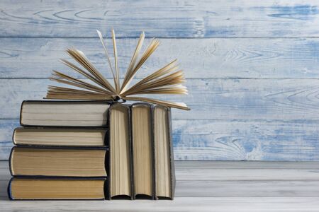 Open book, hardback books on wooden table. Back to school. Copy spaceの写真素材