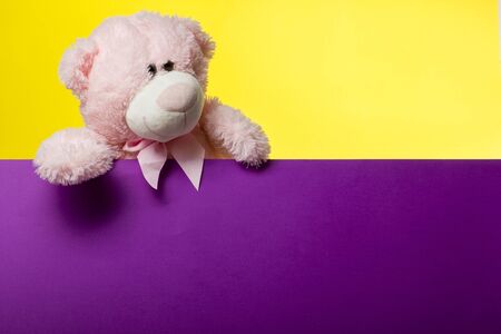Cute teddy bear pink on old wood background with copy spaceの写真素材