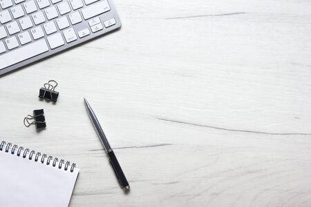 White desk office with laptop, smartphone and other work supplies with cup of coffee. Top view with copy space for input the text. Designer workspace on desk table essential elements on flat lay.の写真素材