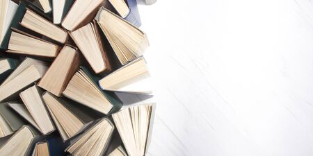 Old and used hardback books or text books from above.の写真素材