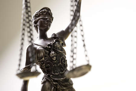 Legal law concept image, close up detail of scales of justice with copy spaceの写真素材